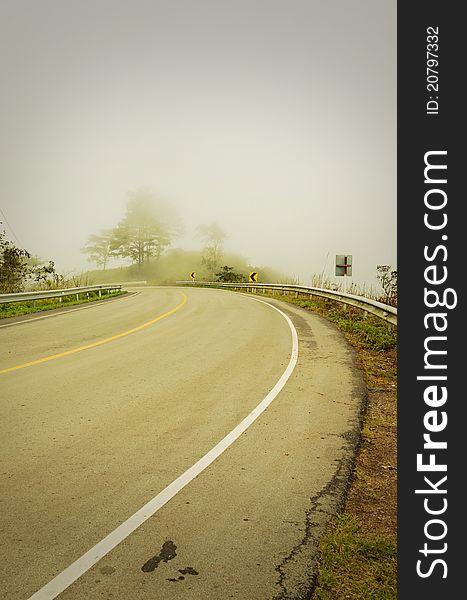 An image of a road covered in fog