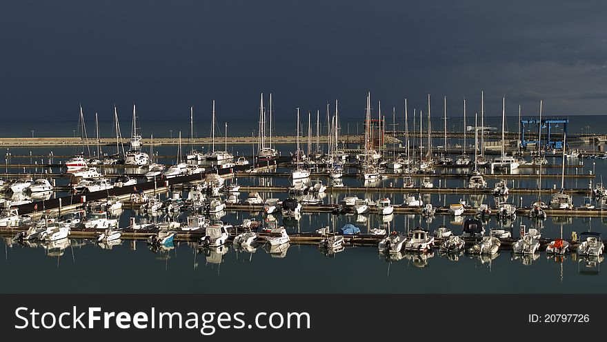 Italy, Siciliy, Mediterranean sea, Marina di Ragusa, view of luxury yachts in the marina. Italy, Siciliy, Mediterranean sea, Marina di Ragusa, view of luxury yachts in the marina