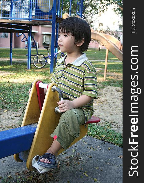 Boy on seesaw