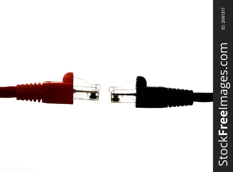 Red and black RJ45 endings against each other on the white back ground. Red and black RJ45 endings against each other on the white back ground