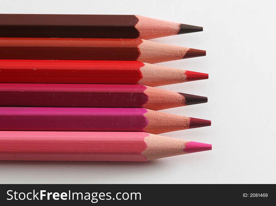 A macro shot of the front end of a group of colored pencils, isolated on white. A macro shot of the front end of a group of colored pencils, isolated on white