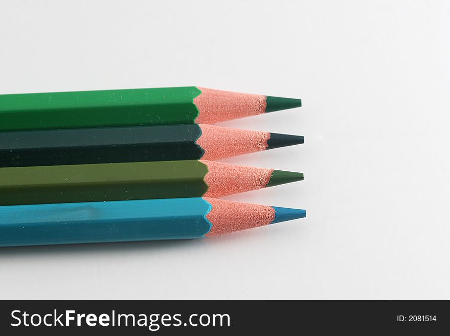 A macro shot of the front end of a group of colored pencils, isolated on white. A macro shot of the front end of a group of colored pencils, isolated on white