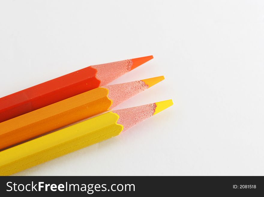 A macro shot of the front end of a group of colored pencils, isolated on white. A macro shot of the front end of a group of colored pencils, isolated on white