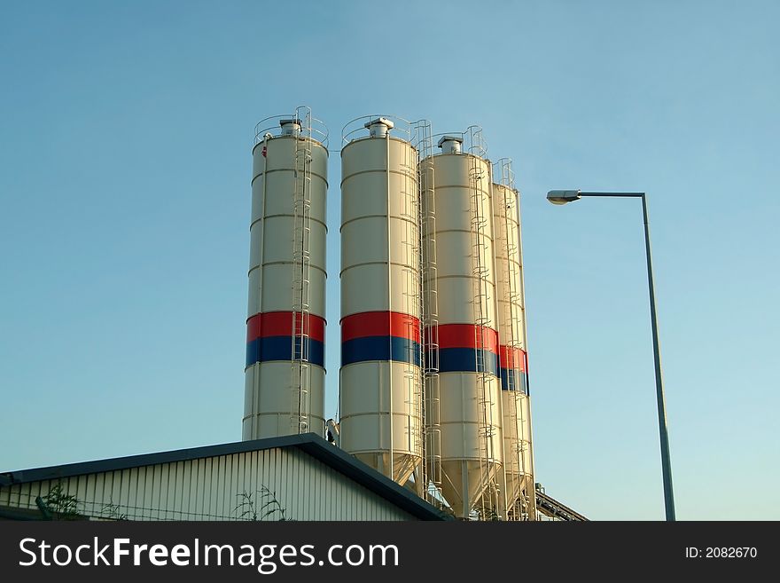 Silo tanks in roof of industrial factory. Silo tanks in roof of industrial factory