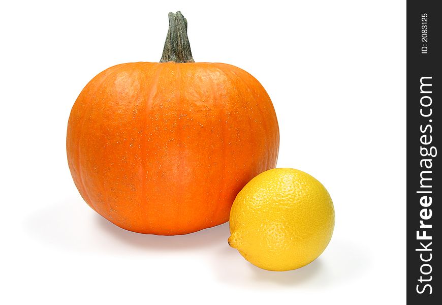Pumpkin and lemon isolated on white. Contains clipping path. Pumpkin and lemon isolated on white. Contains clipping path.