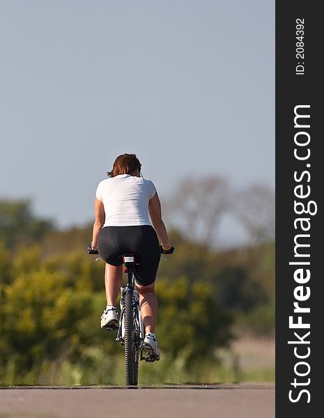 Woman on the bicycle in the park