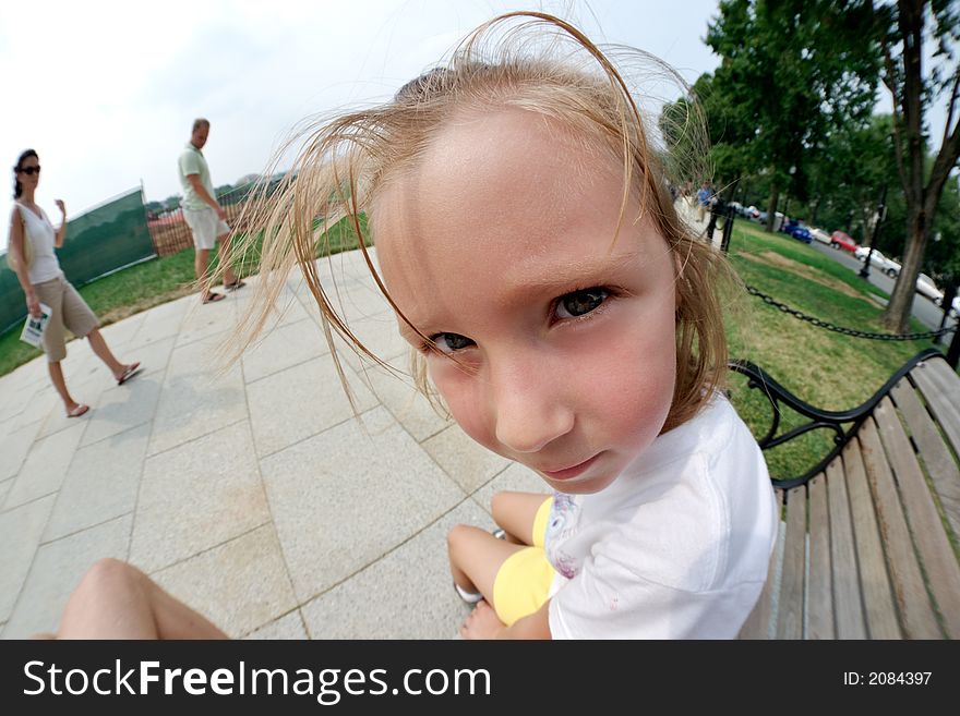 Little girl sitting on a bench near White House. Washington DC, USA. Little girl sitting on a bench near White House. Washington DC, USA