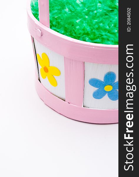 Easter basket filled with artificial grass with space for text