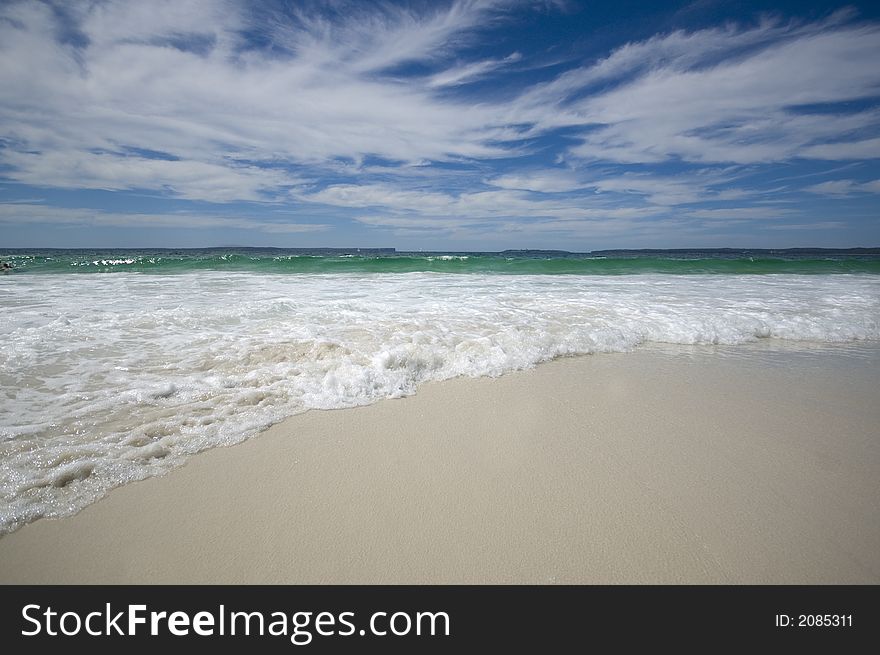 Closeup view of waves crashing on a tropical beach. Closeup view of waves crashing on a tropical beach