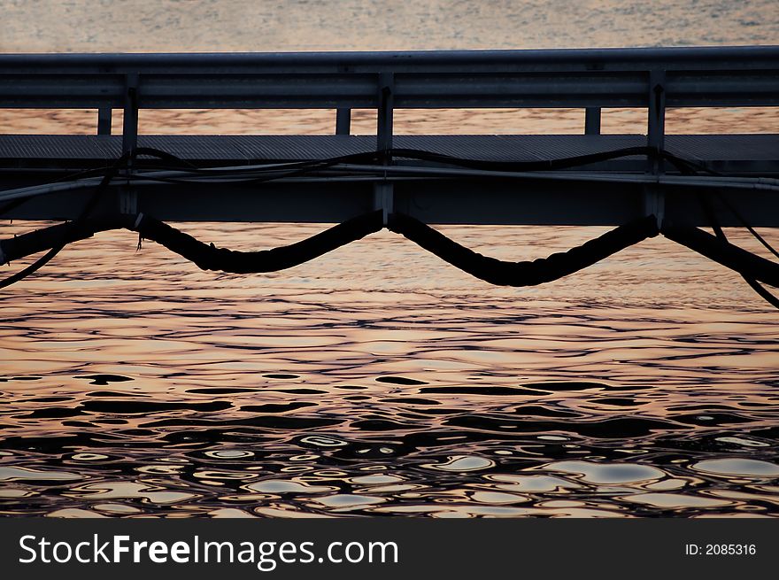 A small bridge with water and sunset. A small bridge with water and sunset