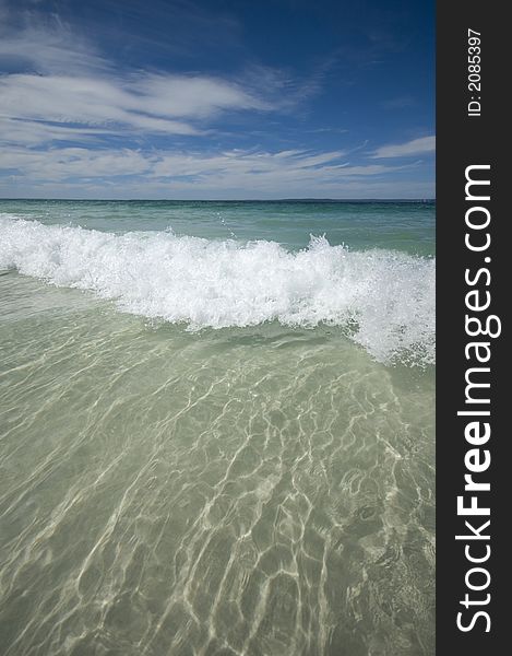 Closeup view of waves crashing on a tropical beach. Closeup view of waves crashing on a tropical beach