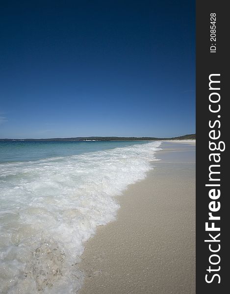 Closeup view of waves crashing on a tropical beach. Closeup view of waves crashing on a tropical beach