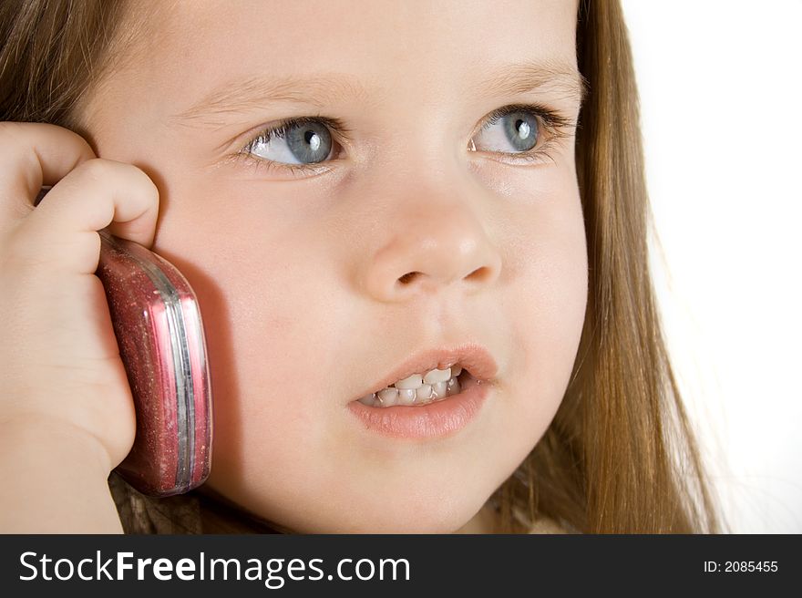 Little girl talking at phone