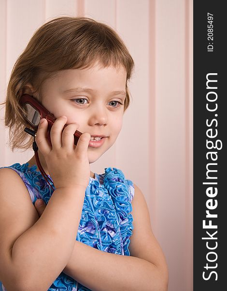 Little Girl Talking At Phone