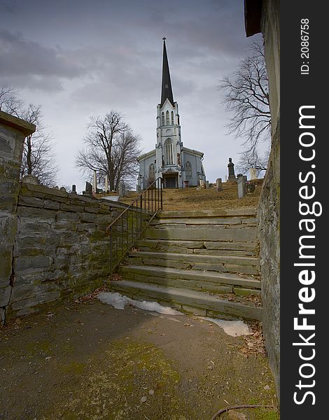 Long shot of a church and its grave yard. Long shot of a church and its grave yard