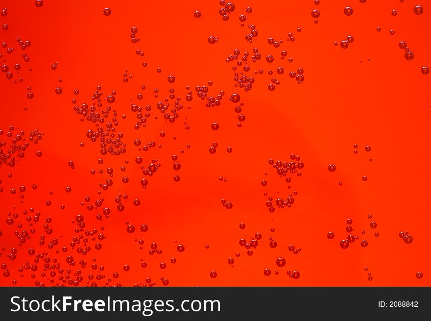 Sparkling Bubbles in an orange liquid