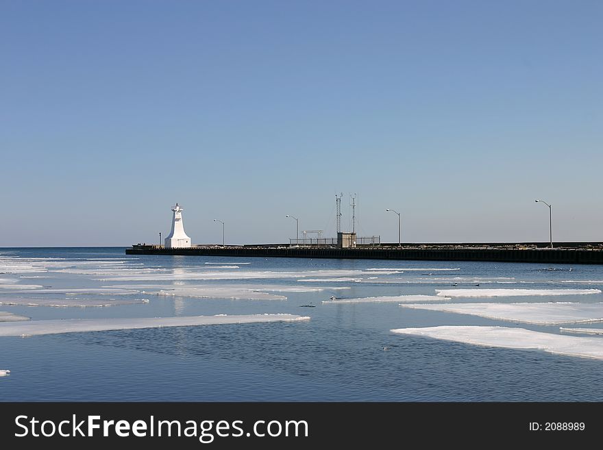 Sheets of ice melt in the harbour. Sheets of ice melt in the harbour