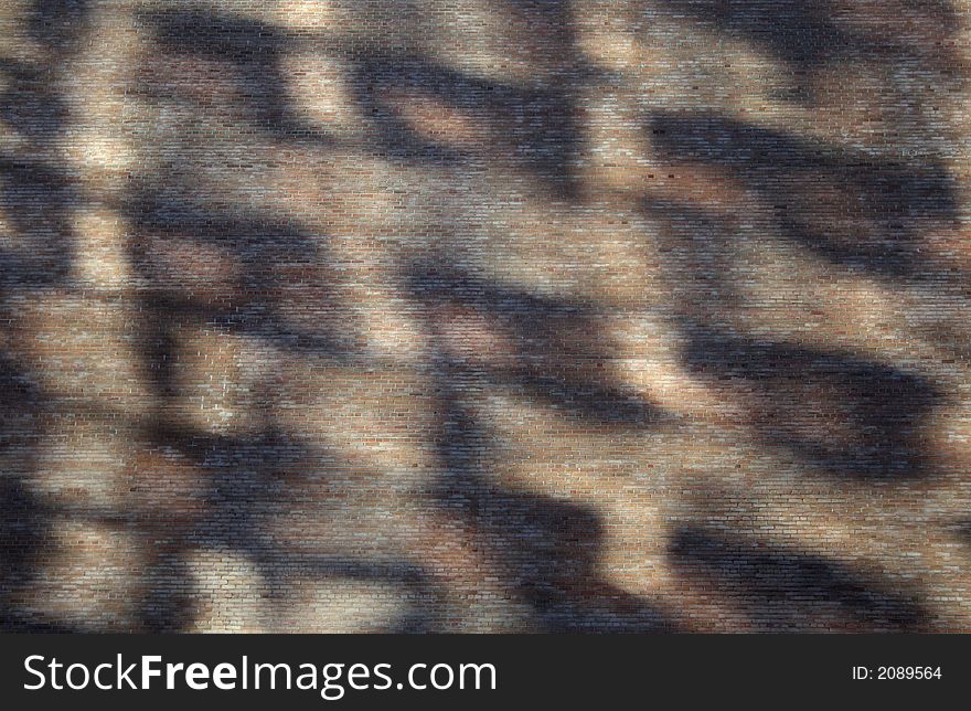 Abstract shadows on a brick wall