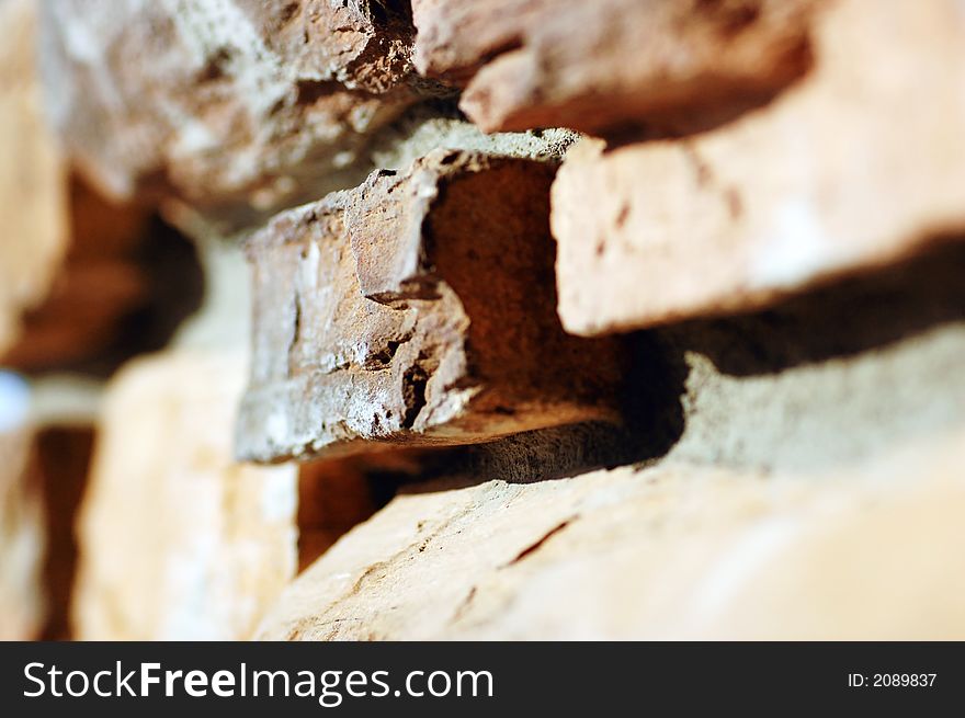 A wall constructed of stone and mortar, very narrow focus. A wall constructed of stone and mortar, very narrow focus