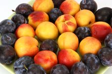 Natural Ripe Plums And Peaches Royalty Free Stock Images
