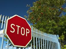 Stop Sign On The Old Gate Stock Images