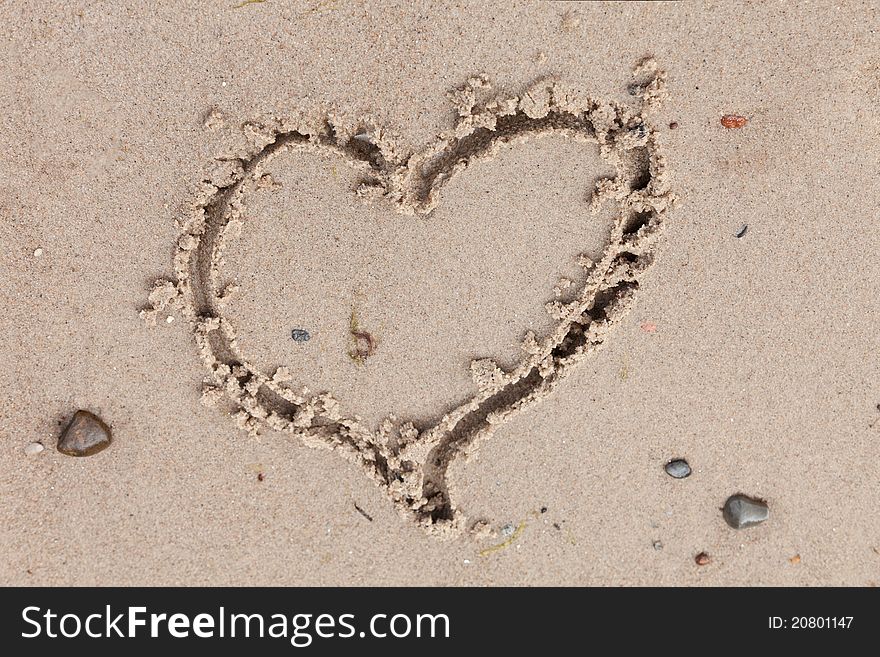 Love expression, an heart drawn on the beach sand. Love expression, an heart drawn on the beach sand.