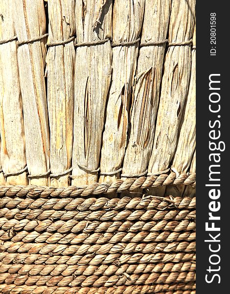 Weathered cane and rope basket in the morning sun. Weathered cane and rope basket in the morning sun.