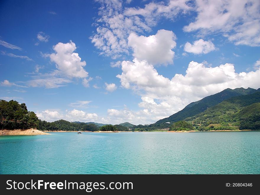 Green Water And Blue Sky