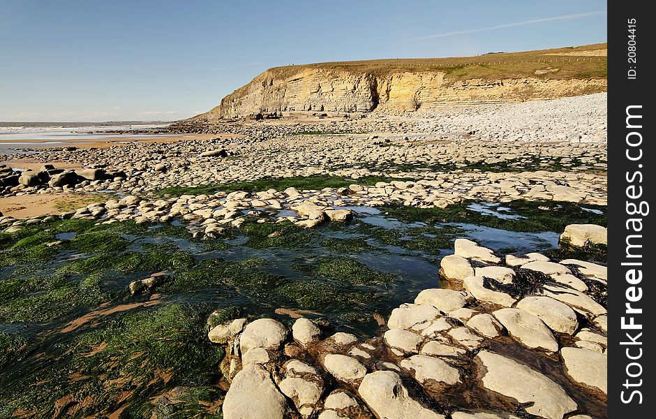 Dunraven Beach cliffs and shore at low tide, Southerndown, Wales Heritage Coast. Dunraven Beach cliffs and shore at low tide, Southerndown, Wales Heritage Coast