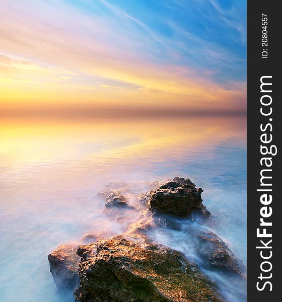 Sea and rock at the sunset. Seascape composition. Sea and rock at the sunset. Seascape composition.