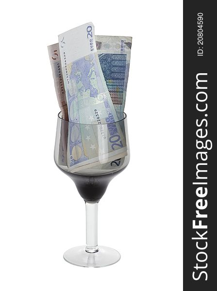 Euro denominations in a glass on a white background. Euro denominations in a glass on a white background.