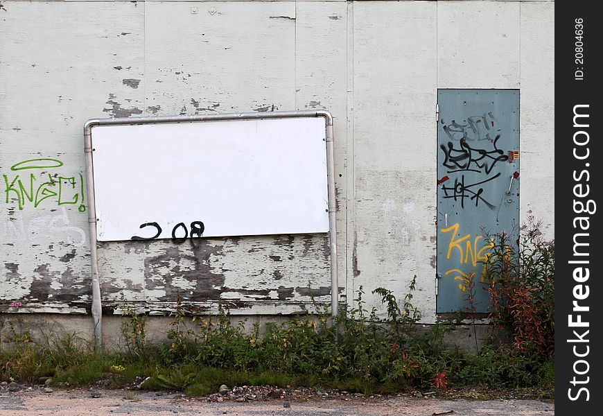 Blank sign on grungy building