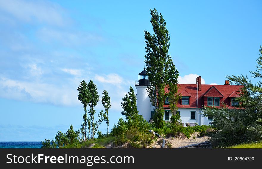 Pt. Betsie lighthouse, lake Michigan, with trees and water