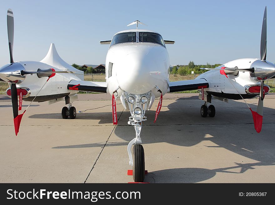 The image of an airplane stands at an airport