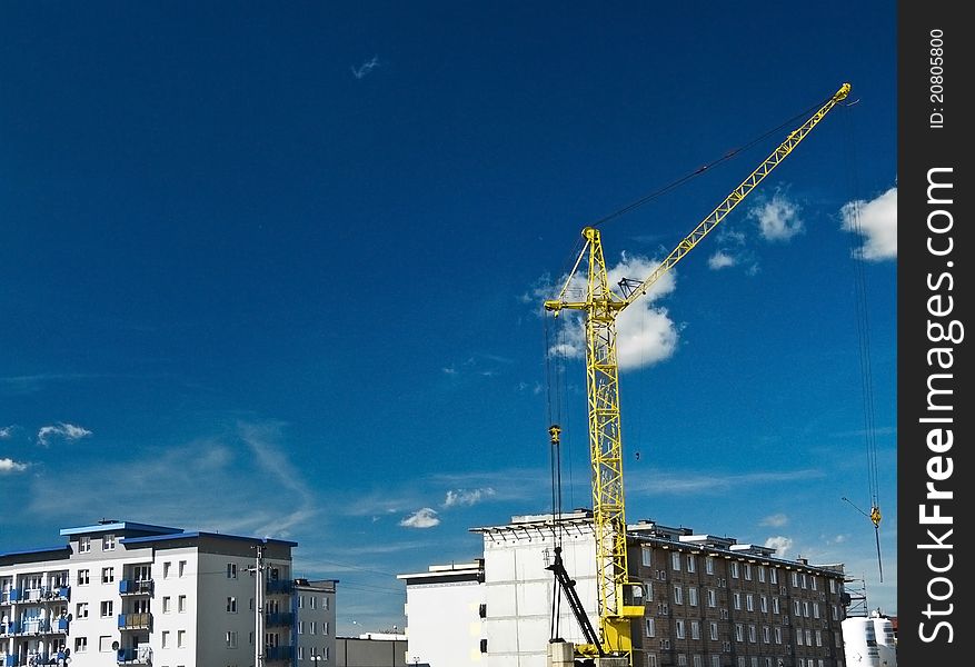 Yellow crane and buildings