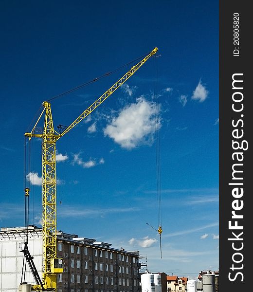 Yellow crane at the blue sky. Yellow crane at the blue sky