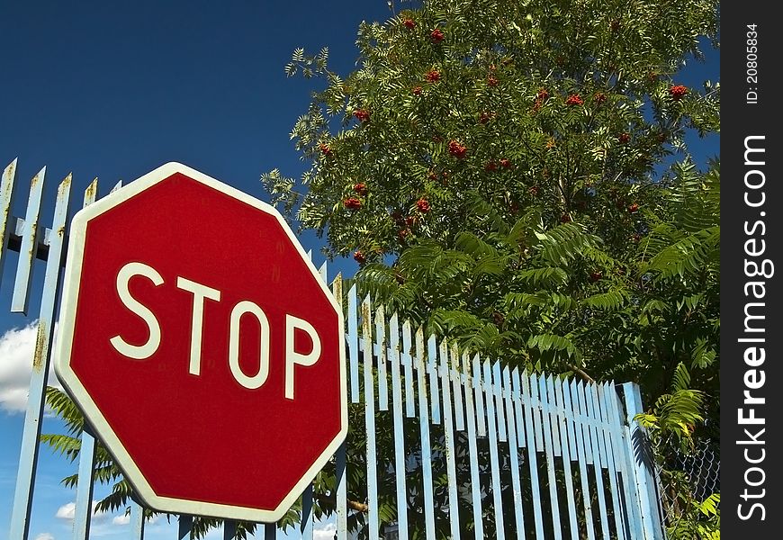 Stop Sign On The Old Gate