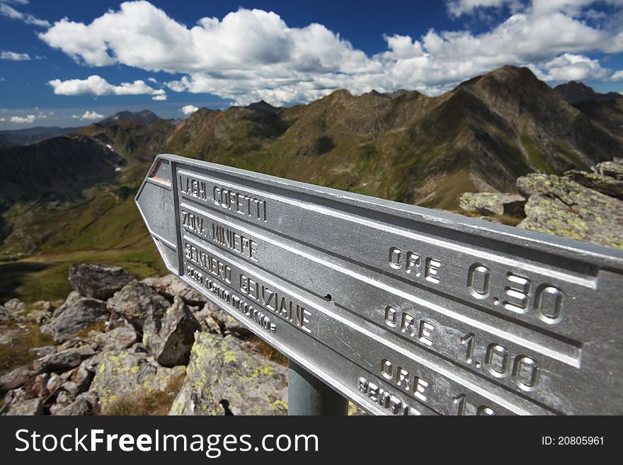 Road signs for hikers and trekkers at 2.500 meters on the sea-level. Italian Alps. Road signs for hikers and trekkers at 2.500 meters on the sea-level. Italian Alps