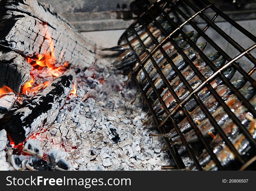 Grilled fish getting ready on charcoal fire. Grilled fish getting ready on charcoal fire