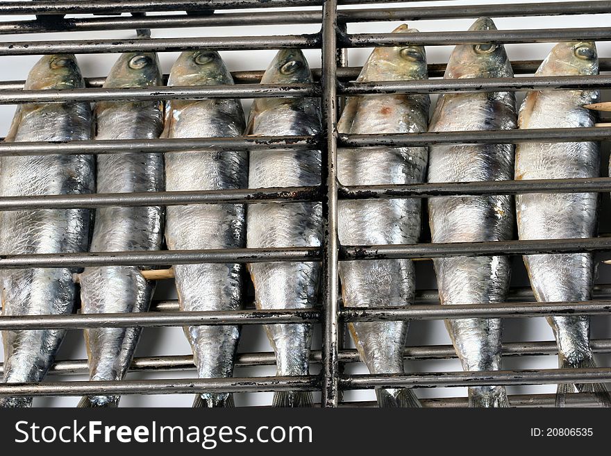 Grilled fish getting ready on charcoal fire