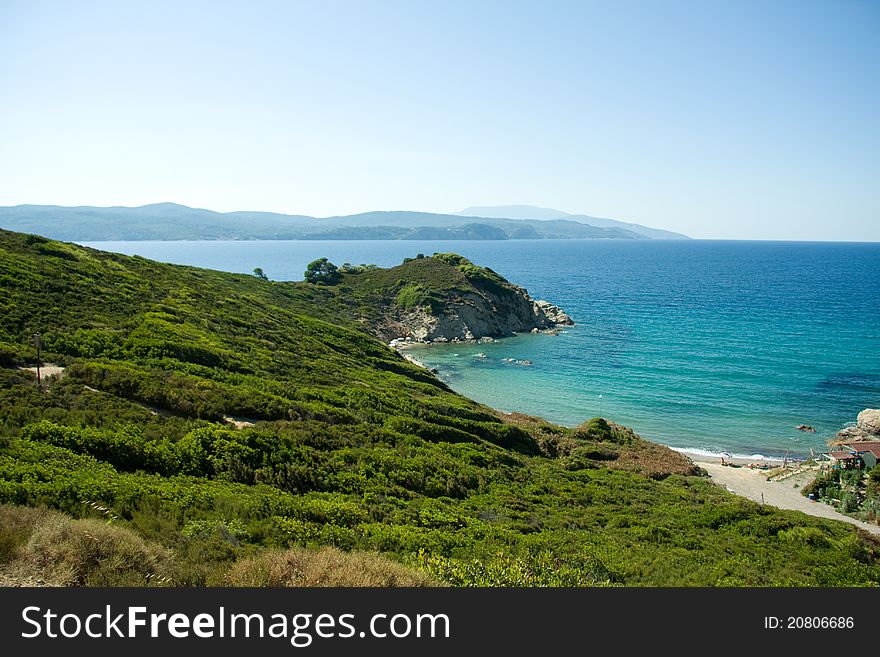 View of a blue bay in Skiathos, Greece. View of a blue bay in Skiathos, Greece