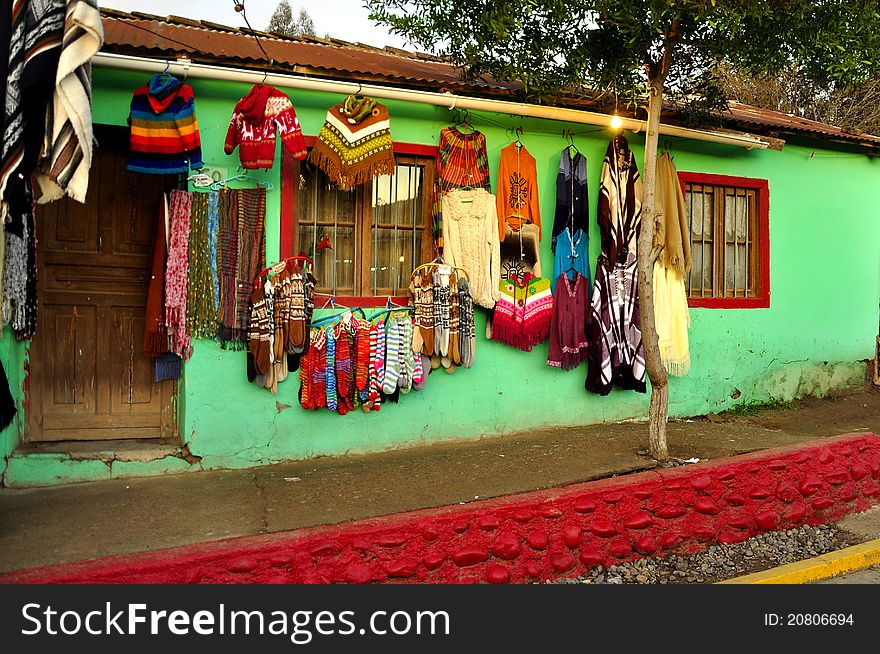 Colorful House With A Sale Of Clothes