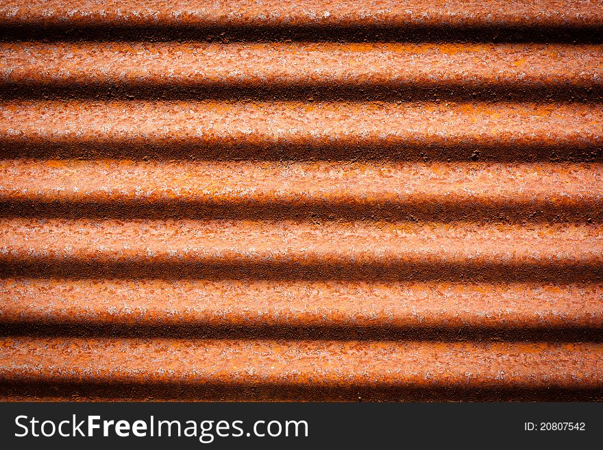 A rusty corrugated iron metal texture.It's a roof.