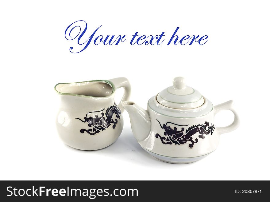 Chinese ceramic teakettle and mug isolated on white background