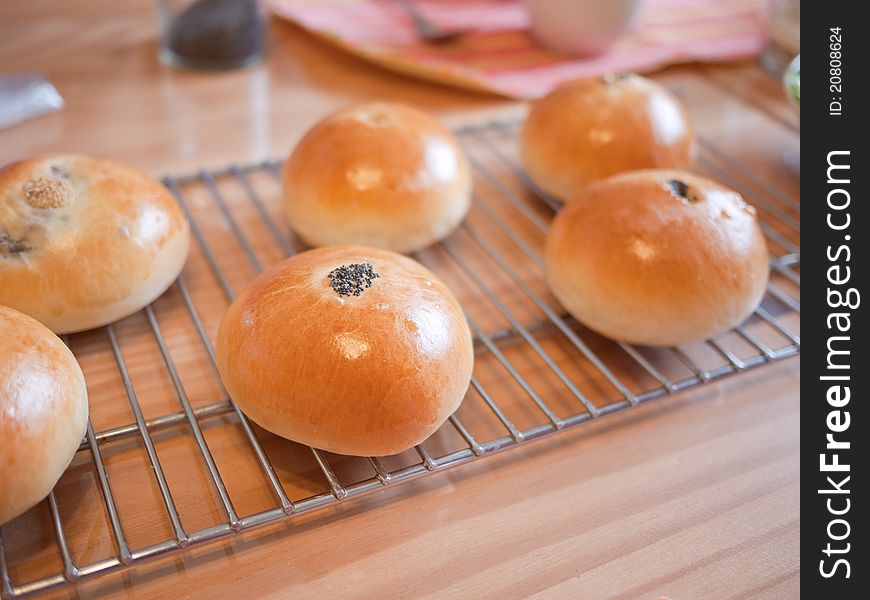 Assorted buns out cooling on oven rack. Assorted buns out cooling on oven rack