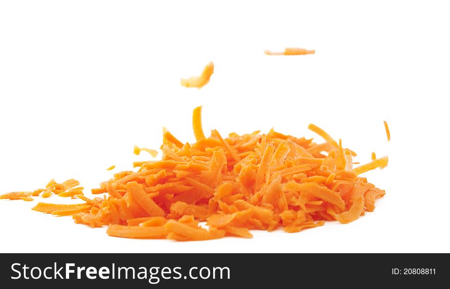 Shredded carrots on a white background