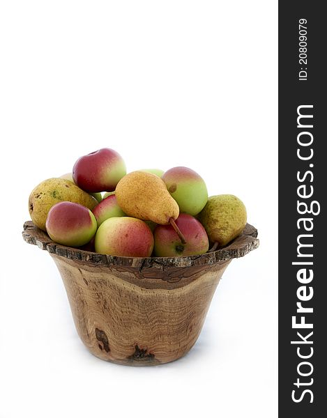 Organic fruit pears and apples in wooden bowl