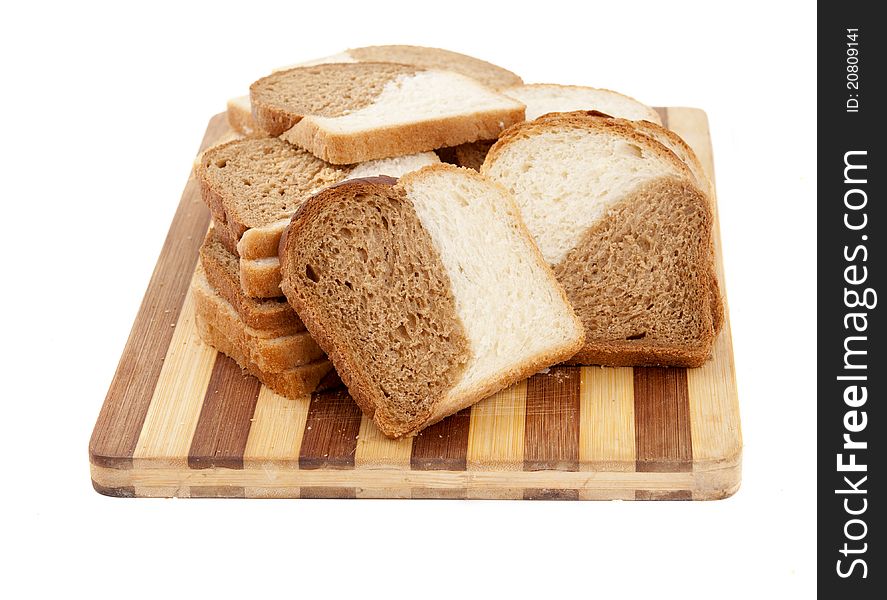 Sliced bread on a board on a white background