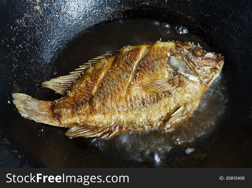 Fish frying in hot oil