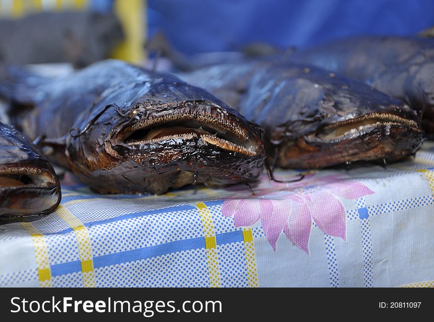 Smoked fish a catfish close up on a table